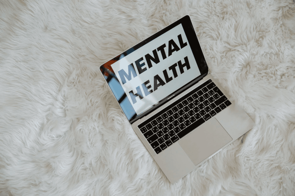 Laptop with the words Mental Health on the screen 
